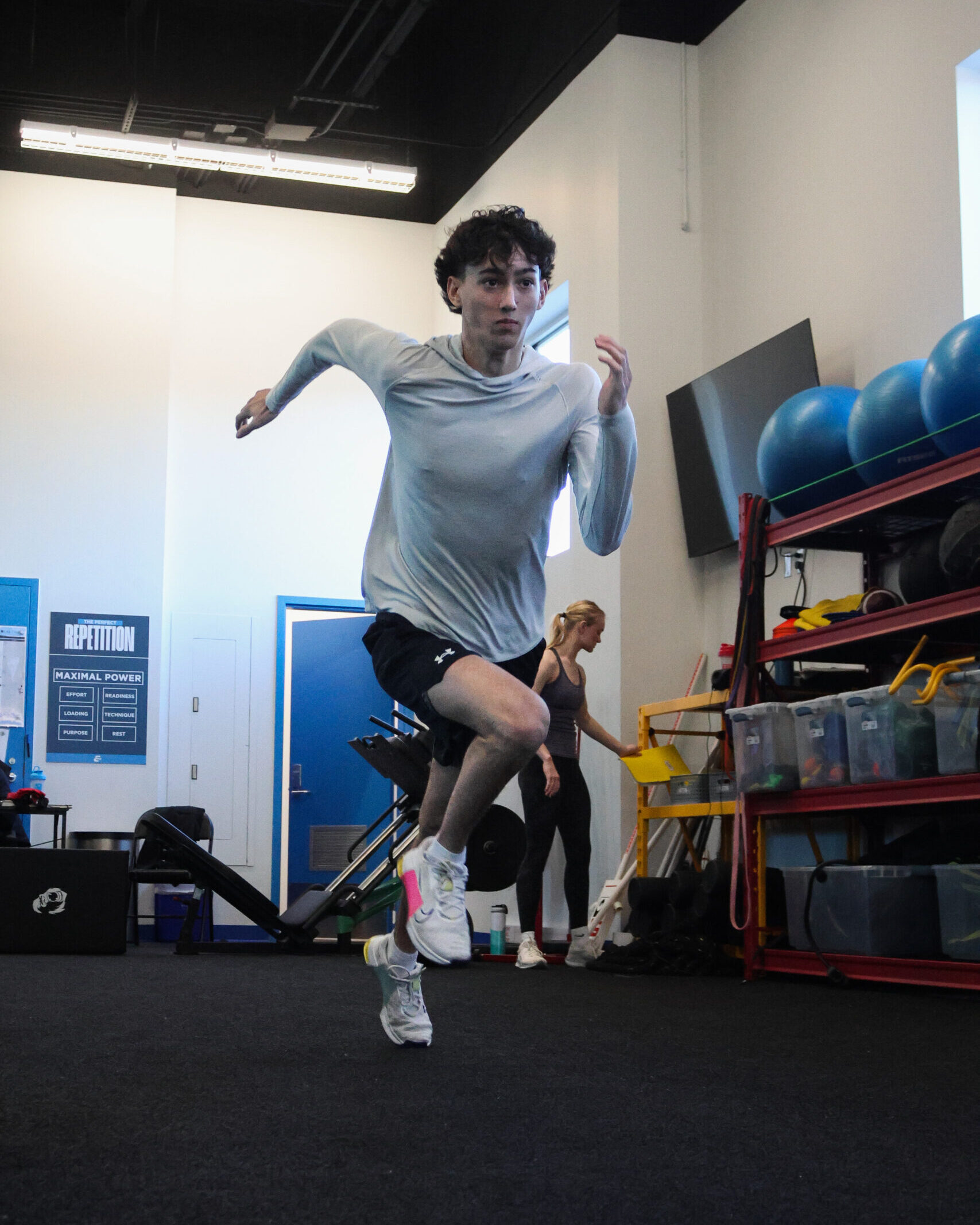 A male student sprinting as part of their strength and conditioning training.