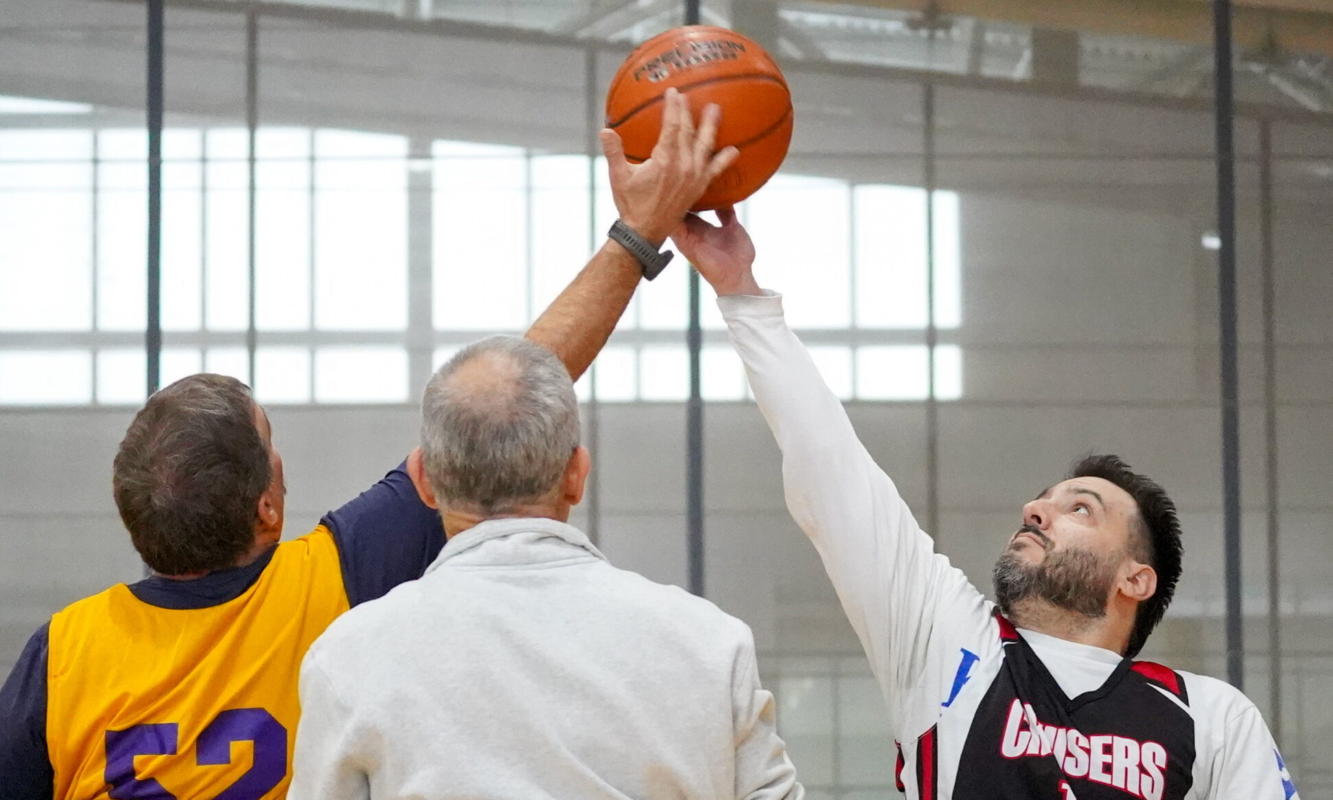 The tip-off of a wheelchair basketball game.