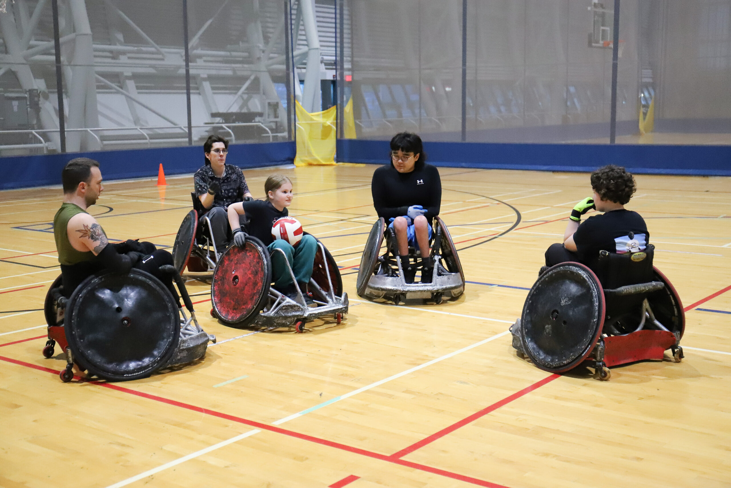 A group playing wheelchair rugby.