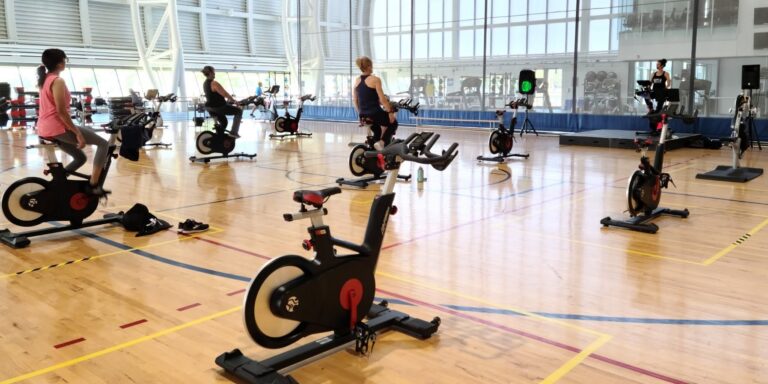 People taking a spin class on the court.