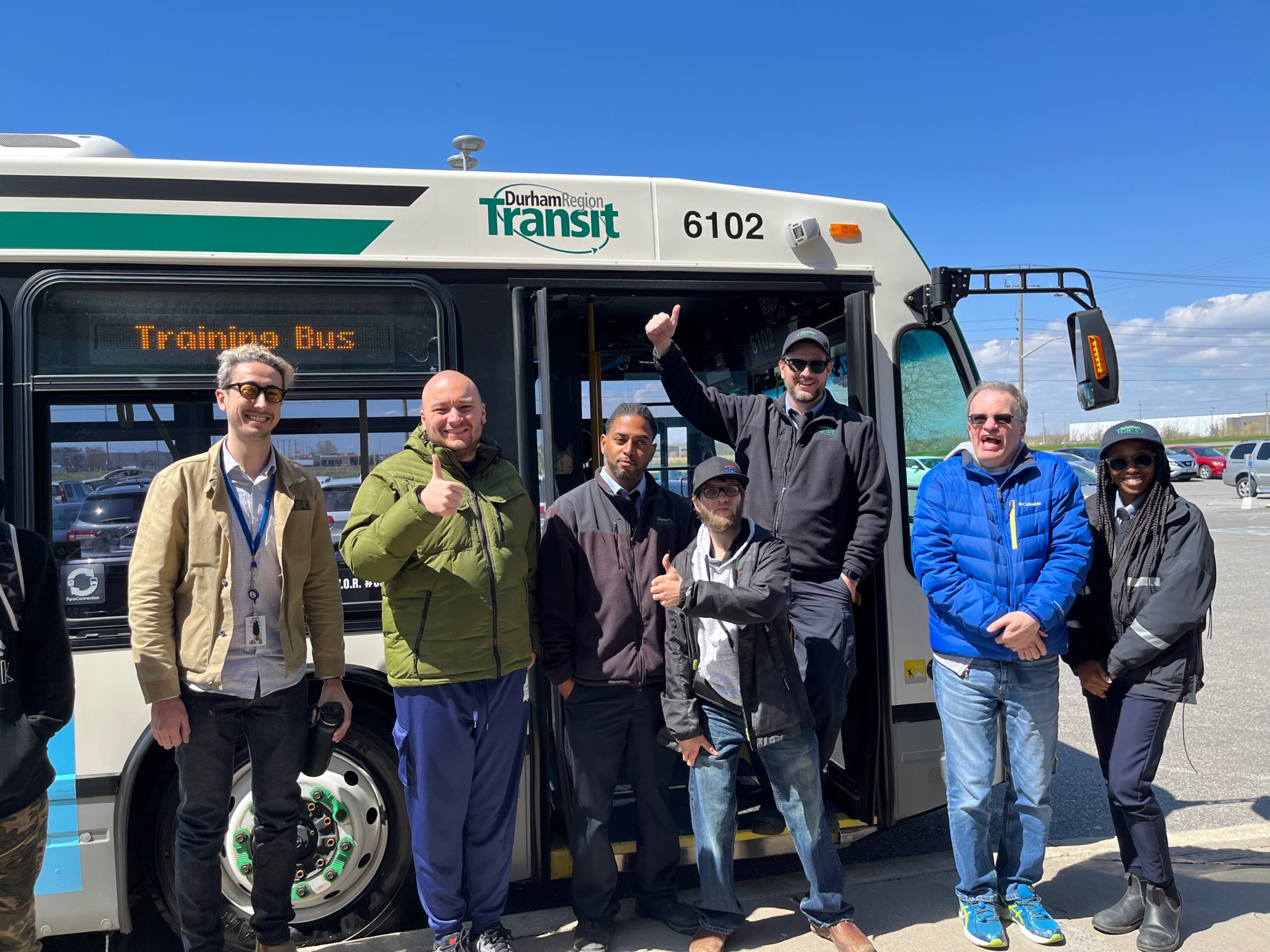 Participants pose with a Durham Region Transit driver.