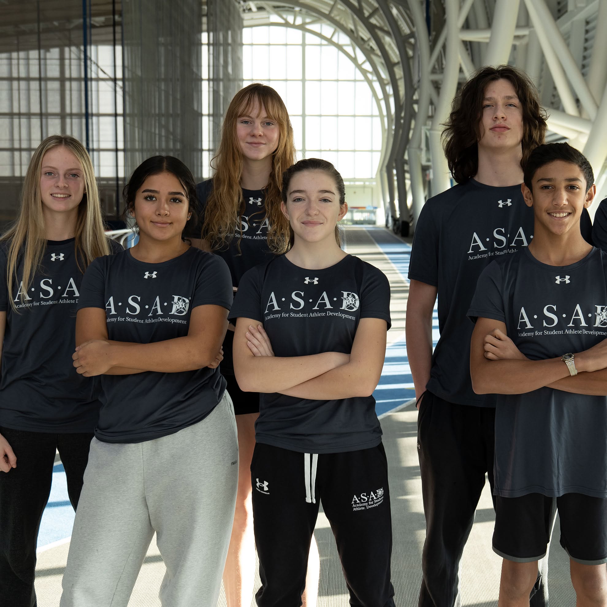 A group of A.S.A.D. Durham students posing in their A.S.A.D. shirts.