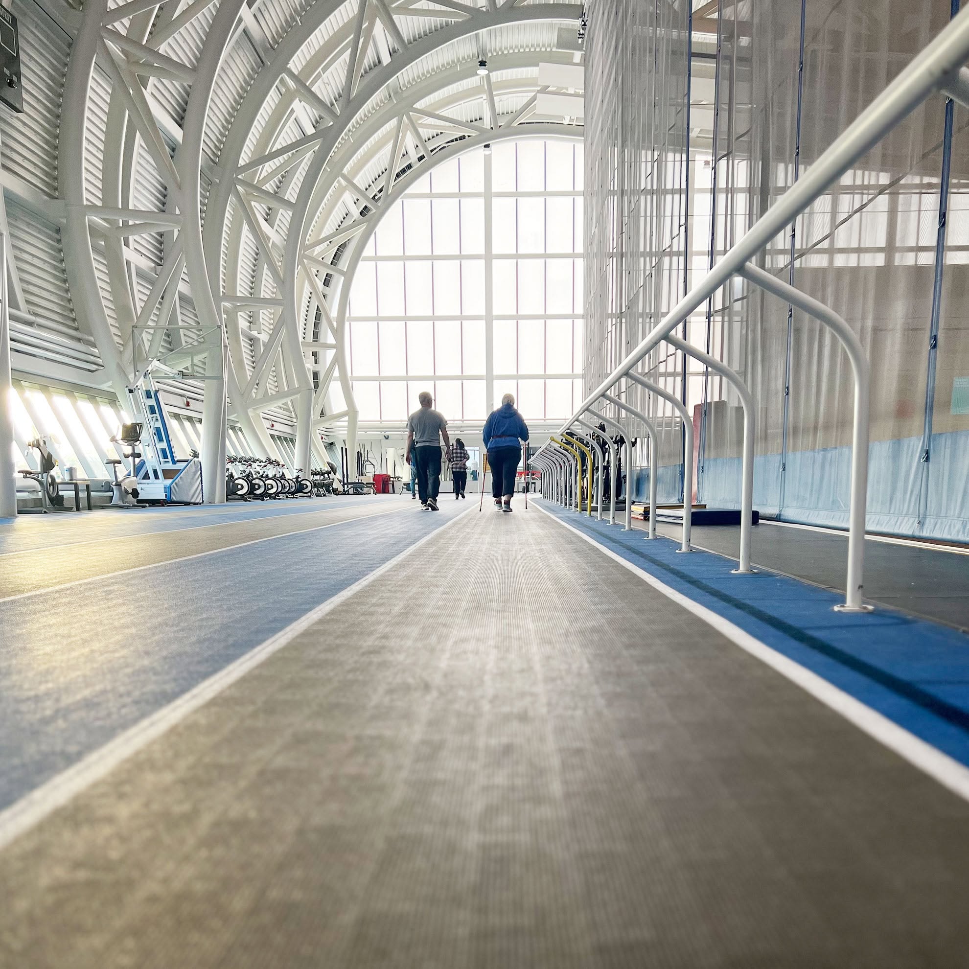 People walking the track in the Jim Flaherty Field House.