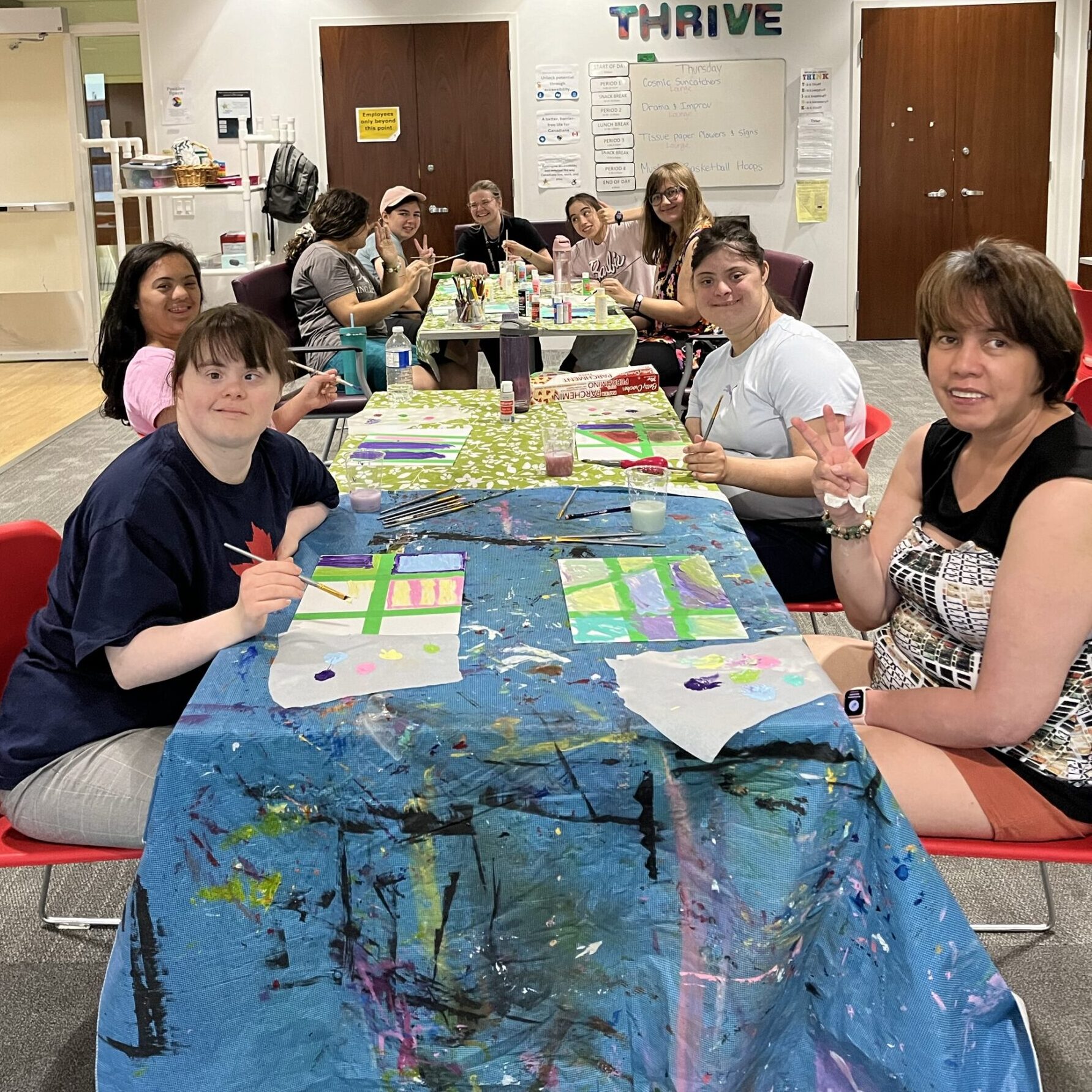 Participants being creative as they work on painting projects.