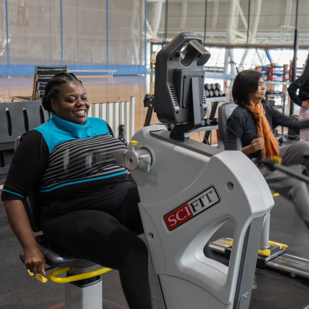 Members smile as they use the exercise machines in the Jim Flaherty Field House.