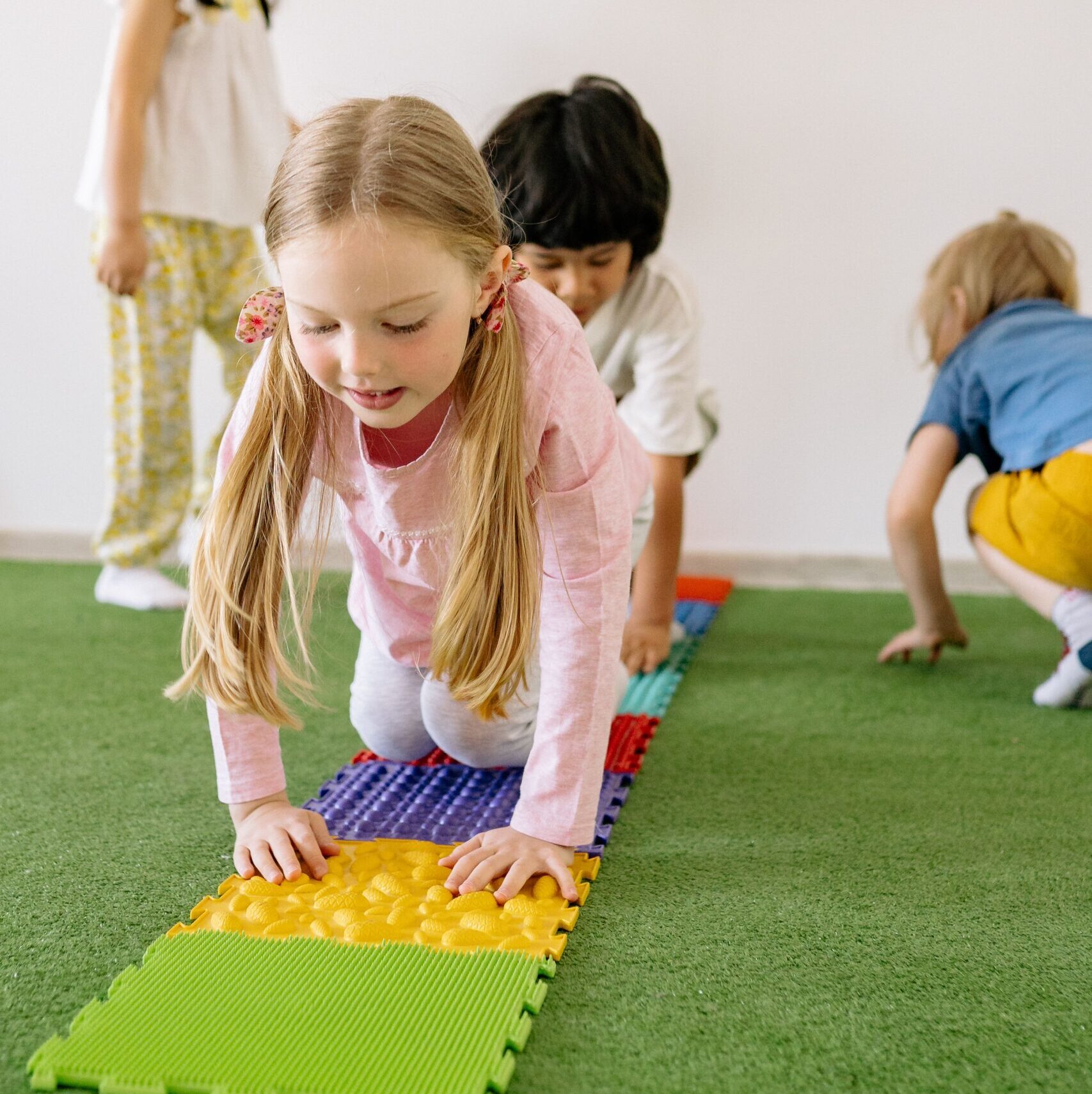 Children playing on a tactile map.
