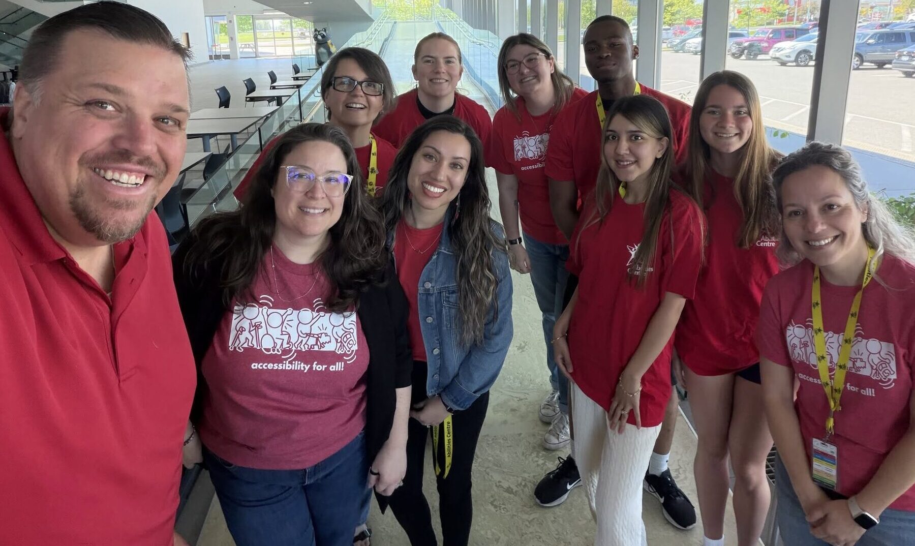 A group of Abilities Centre staff pose in their red shirts in honour of Red Shirt Day.