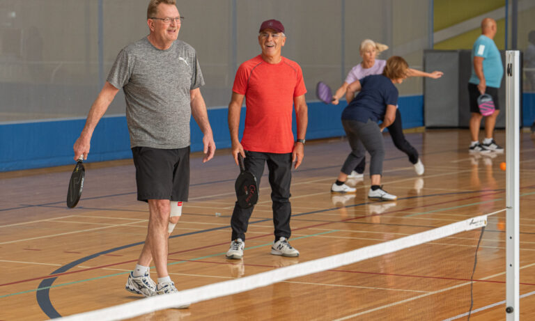 People playing pickleball.
