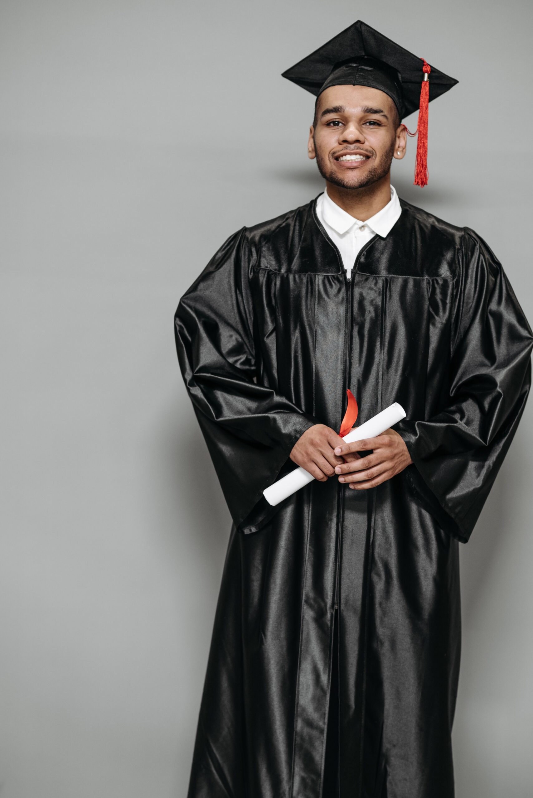 A person wearing a graduation cap and gown.